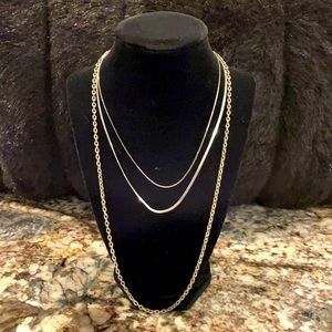 Set of three Silver tone necklaces. J101